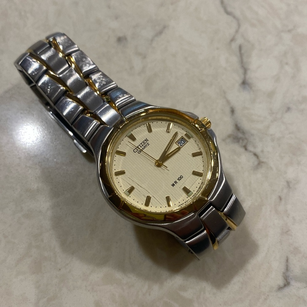 Citizens silver with gold accent men’s watch